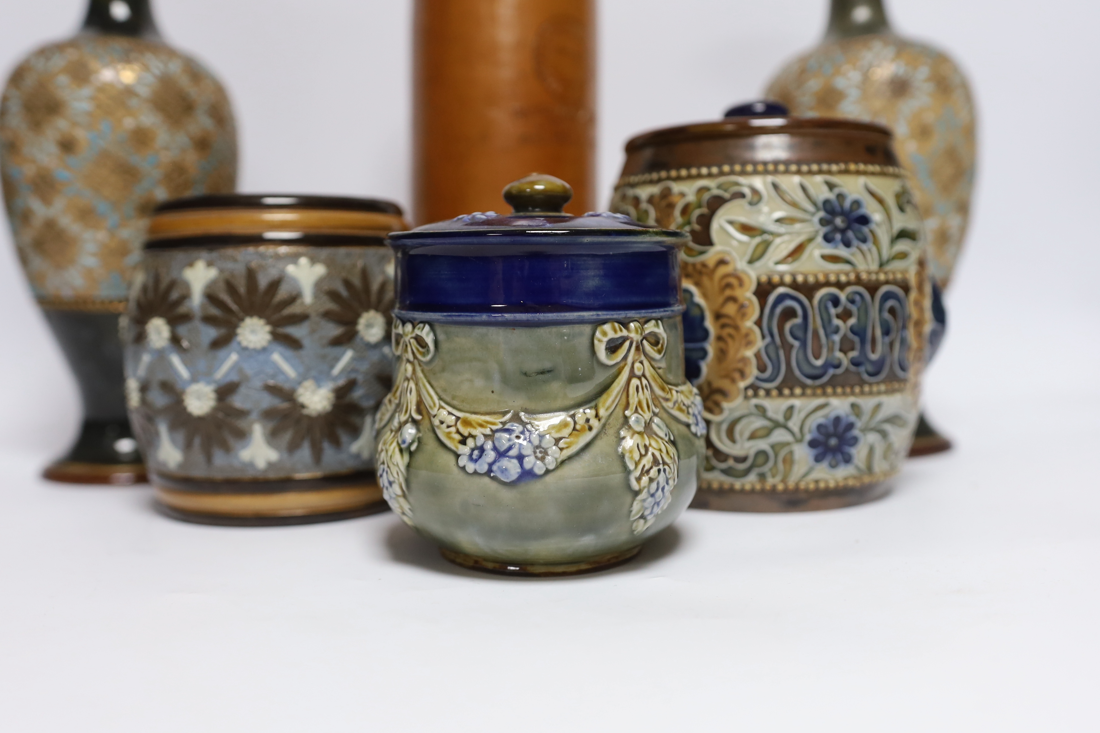 A pair of Doulton Lambeth vases, three jars, two with covers and a Georg Kreuzberg terracotta bottle